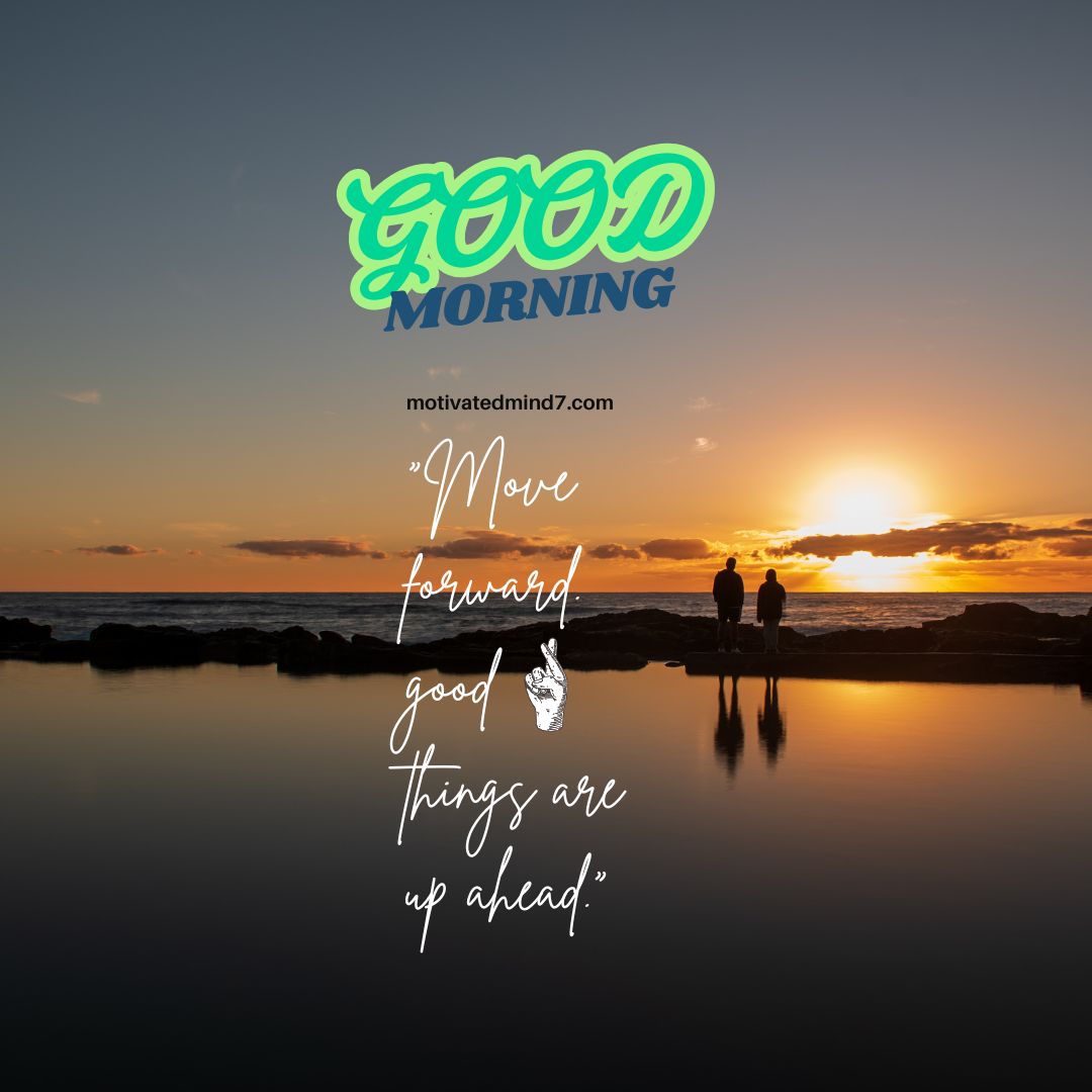 two people standing on a beach at sunset